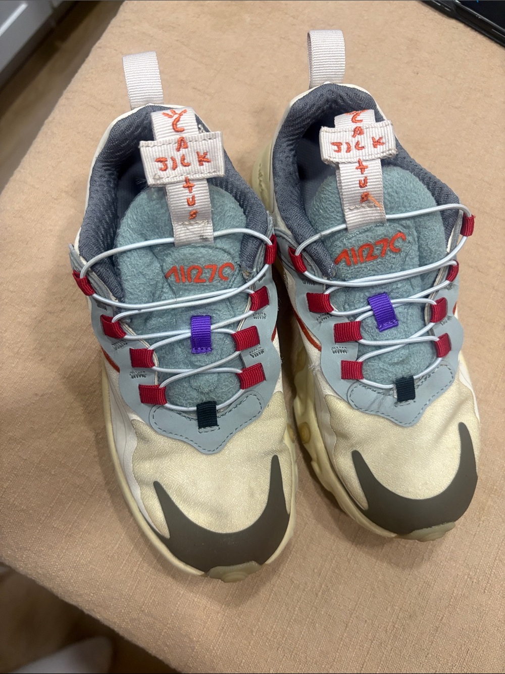 Nike Travis Scott’s Kids Sneakers in Cream, Gray, Red & Purple Accents
